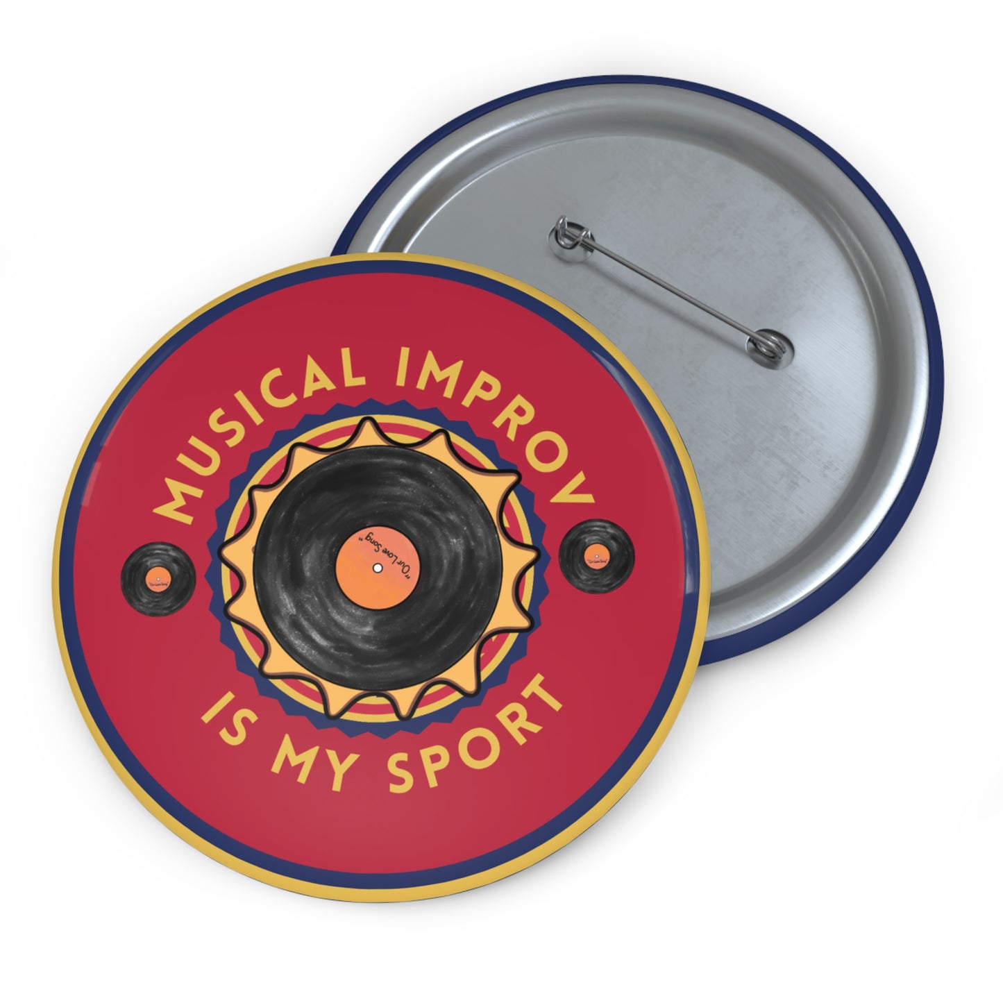 and back of A colorful round pinback button featuring a vinyl record design with the text "Musical Improv Is My Sport" on a bold red background. The pin's back is shown alongside, displaying its fastening mechanism.